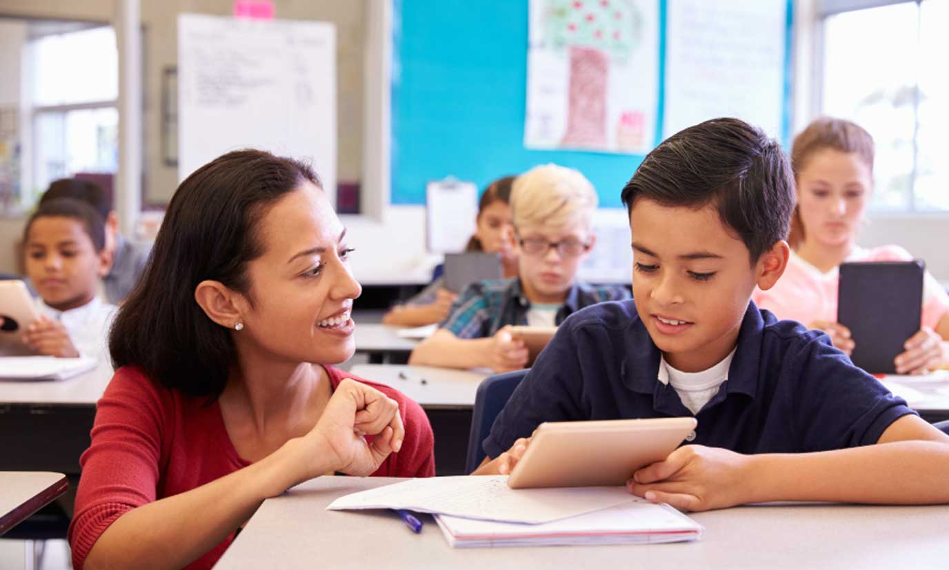 Teacher providing core math instruction to a student
