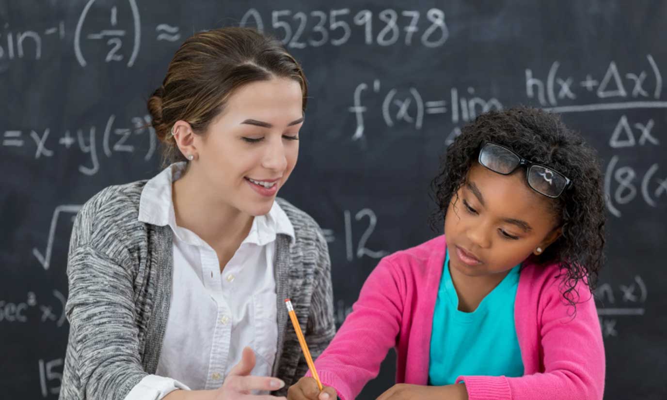 teacher-helping-elementary-school-student-2